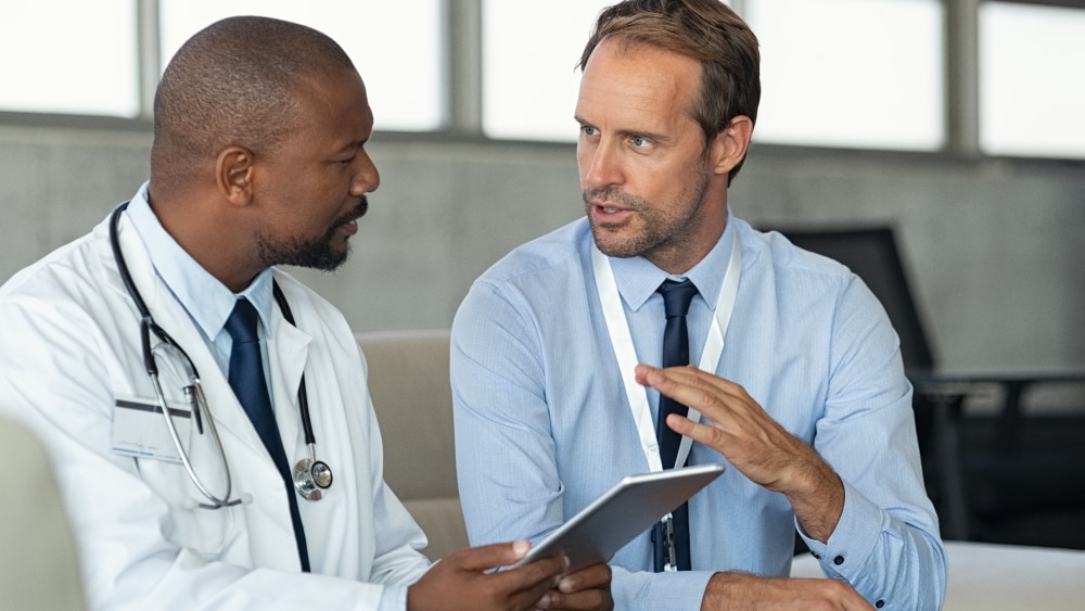 clinicians talking in a hospital setting