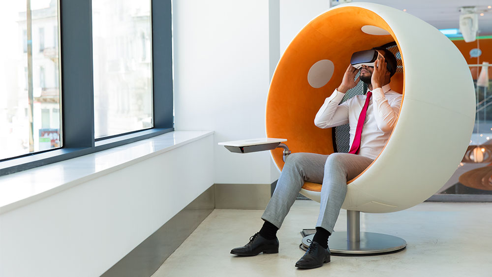 person-sitting-with-virtual-reality-headset