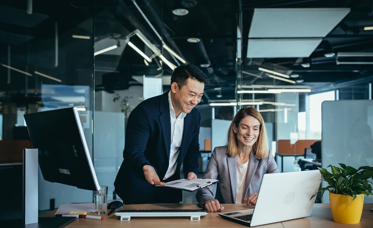 Professionals working on a laptop Professionals working on a laptop