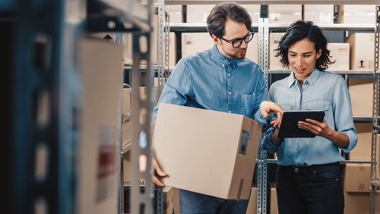 Two people in a retail storage room Two people in a retail storage room