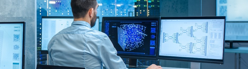 Man working with big monitors Man working with big monitors