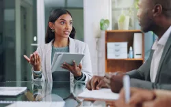 Business woman brainstorming with colleague