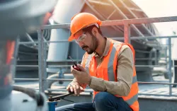 engineer checking industry cooling tower air conditioner