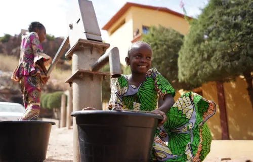 African Girls Fetching Water at the Borehole