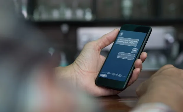 hand using AI chat tool on smartphone