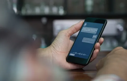 Hand using AI chat tool on a smartphone