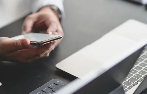 Hands of a person holding mobile