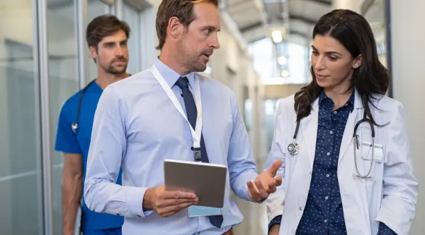 clinicians talking in hospital