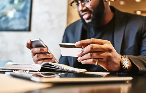 man paying online with payment card