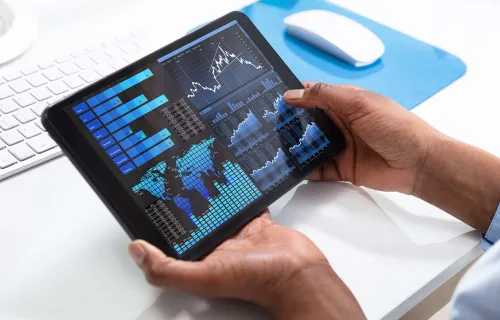 Person reviewing charts on a device