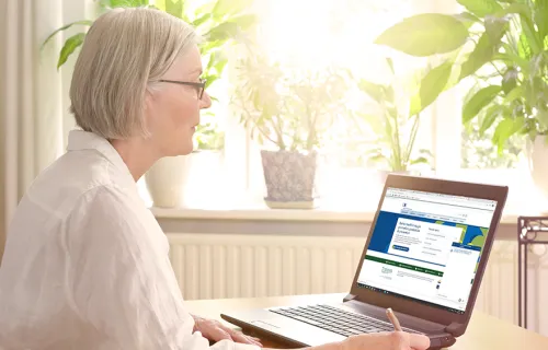 woman using laptop interacting with chatbot