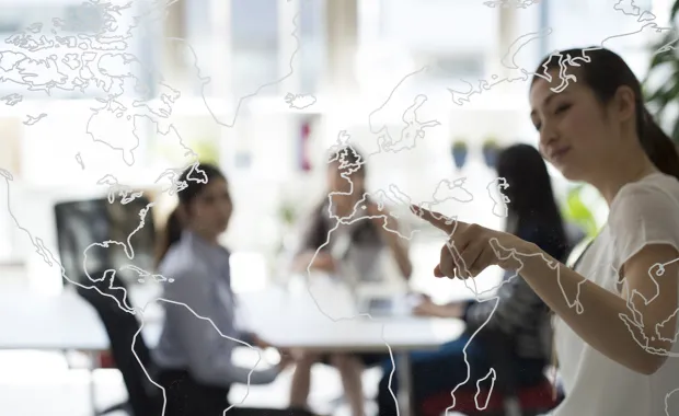 Onsite clients looking at map of globe