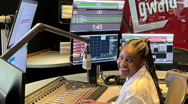 Broadcaster sitting in SABC radio studio