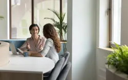 two women discussing